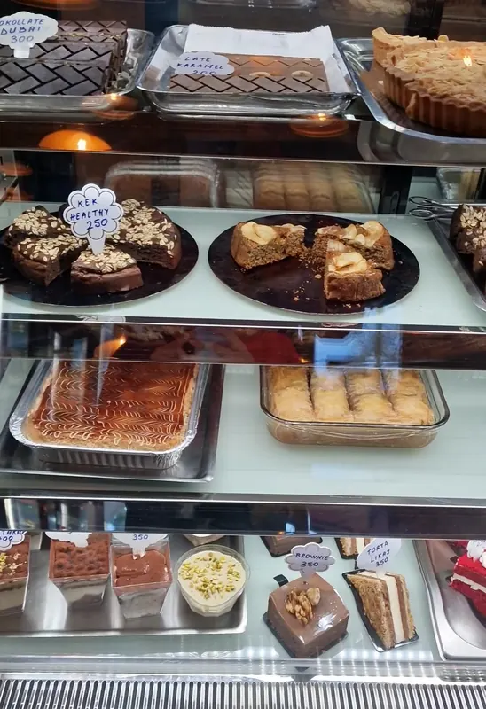 The pastry counter with trays of sweets and cakes