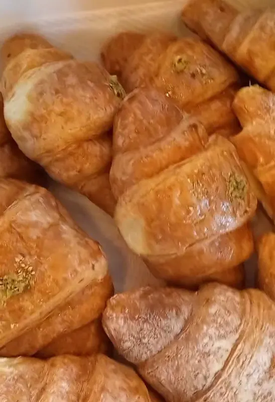 A tray of freshly baked croissants